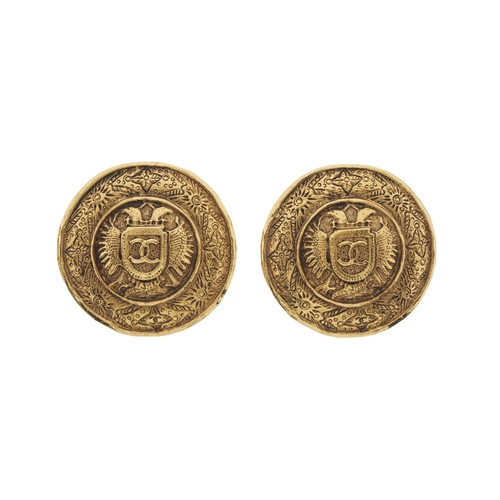 311 - Chanel, a pair of large vintage gold-plated clip-on earrings, decorated with Chanel's iconic logos a... 