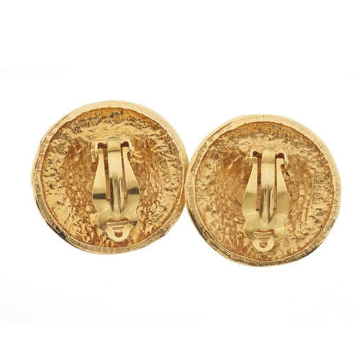 311 - Chanel, a pair of large vintage gold-plated clip-on earrings, decorated with Chanel's iconic logos a... 