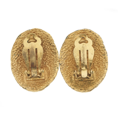 314 - Chanel, a pair of vintage clip-on earrings, gold-tone with woven detailing and central CC logo, sign... 