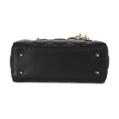 318 - Christian Dior, a small Cannage Lady Dior handbag, designed with a quilted black lambskin leather ex... 