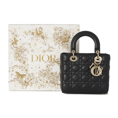 318 - Christian Dior, a small Cannage Lady Dior handbag, designed with a quilted black lambskin leather ex... 