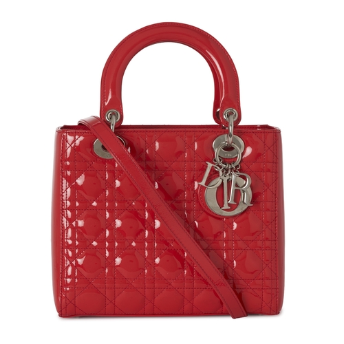 319 - Christian Dior, a red patent leather Lady Dior MM handbag, designed with Dior's signature cannage qu... 