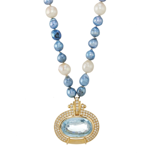 32 - An 18ct gold blue topaz and brilliant-cut diamond pendant, suspended from a bi-colour cultured pearl... 