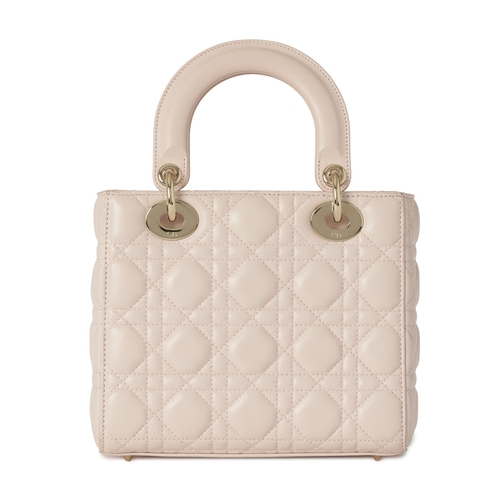 320 - Christian Dior, a small Cannage Lady Dior handbag, designed with a quilted pale pink lambskin leathe... 