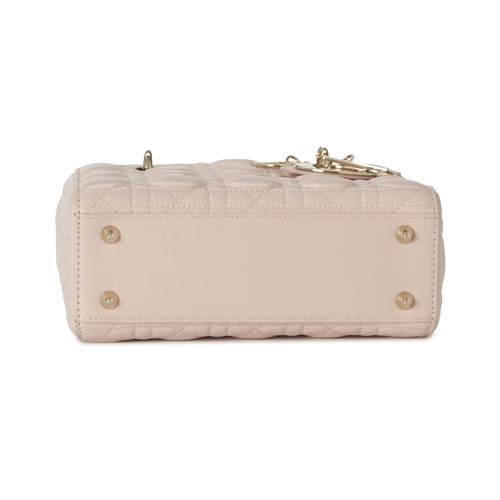 320 - Christian Dior, a small Cannage Lady Dior handbag, designed with a quilted pale pink lambskin leathe... 