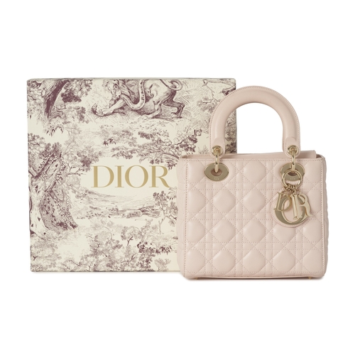320 - Christian Dior, a small Cannage Lady Dior handbag, designed with a quilted pale pink lambskin leathe... 