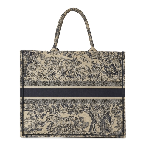 324 - Christian Dior, a large Book Tote, featuring an ecru and blue Toile de Jouy embroidered motif, with ... 