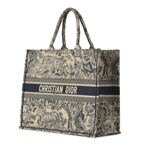 324 - Christian Dior, a large Book Tote, featuring an ecru and blue Toile de Jouy embroidered motif, with ... 