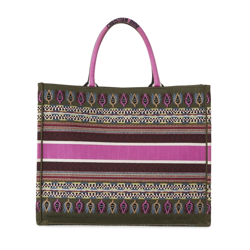 325 - Christian Dior, a large Book Tote, crafted from embroidered multicoloured canvas, with rolled handle... 