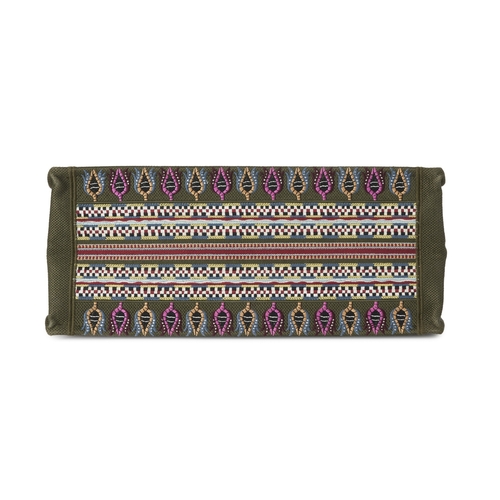 325 - Christian Dior, a large Book Tote, crafted from embroidered multicoloured canvas, with rolled handle... 