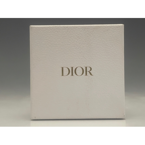 331 - Christian Dior, a gold-tone chain-link choker, with central CD panel, suspending a Dior disc, signed... 