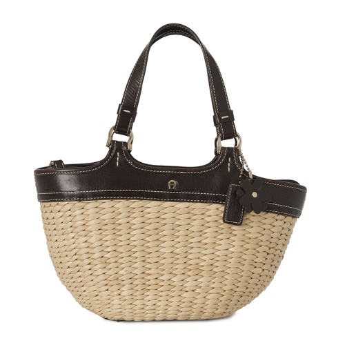 337 - Etienne Aigner, a vintage wicker handbag, with brown leather trim, dual leather handles and top zip ... 