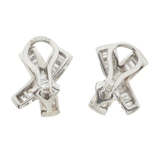 34 - A pair of platinum calibre-cut diamond abstract cross earrings, estimated total diamond weight 1.50c... 