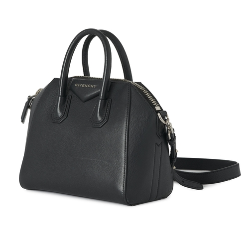 349 - Givenchy, a mini Antigona handbag, designed with a grained black leather exterior, with a triangular... 