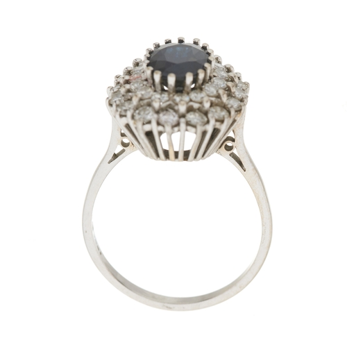 35 - An 18ct gold sapphire and brilliant-cut diamond cluster dress ring, sapphire estimated weight 2.20ct... 