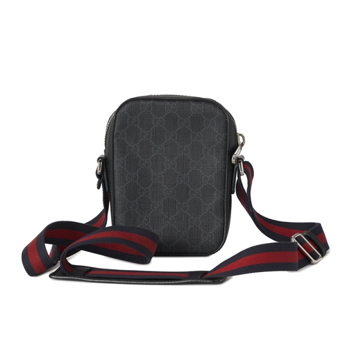 351 - Gucci, a small Supreme messenger bag, crafted from the maker's black GG monogram coated canvas with ... 