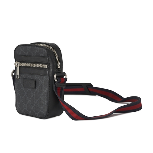 351 - Gucci, a small Supreme messenger bag, crafted from the maker's black GG monogram coated canvas with ... 