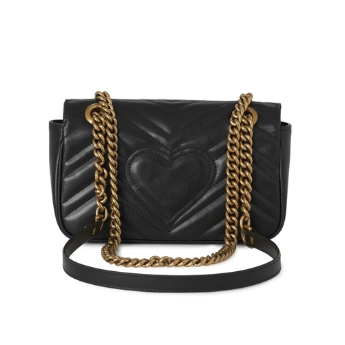 354 - Gucci, a black leather Marmont handbag, featuring a chevron quilted leather exterior with heart deta... 