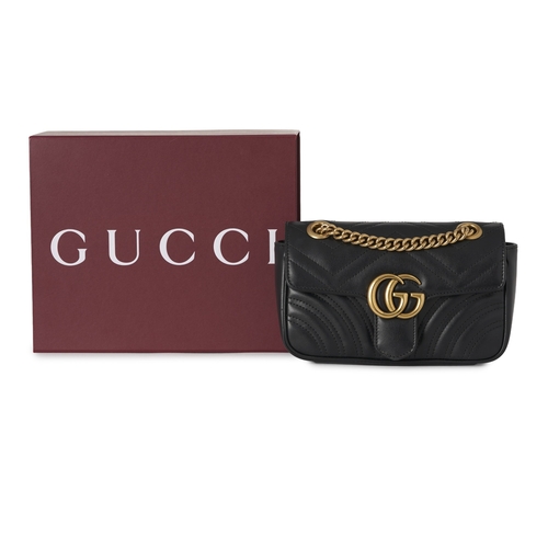354 - Gucci, a black leather Marmont handbag, featuring a chevron quilted leather exterior with heart deta... 