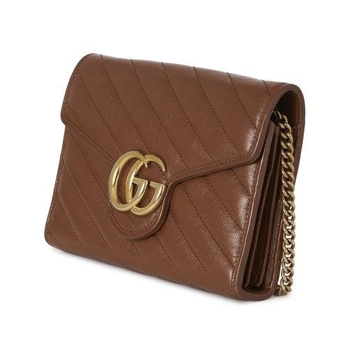 359 - Gucci, a brown leather Marmont chain clutch, designed with a diagonal quilted leather exterior, with... 