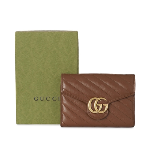 359 - Gucci, a brown leather Marmont chain clutch, designed with a diagonal quilted leather exterior, with... 