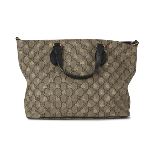 366 - Gucci, a GG Supreme Bee tote, crafted from GG coated canvas with overlayed gold bee motif and black ... 