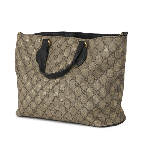 366 - Gucci, a GG Supreme Bee tote, crafted from GG coated canvas with overlayed gold bee motif and black ... 