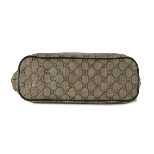 366 - Gucci, a GG Supreme Bee tote, crafted from GG coated canvas with overlayed gold bee motif and black ... 