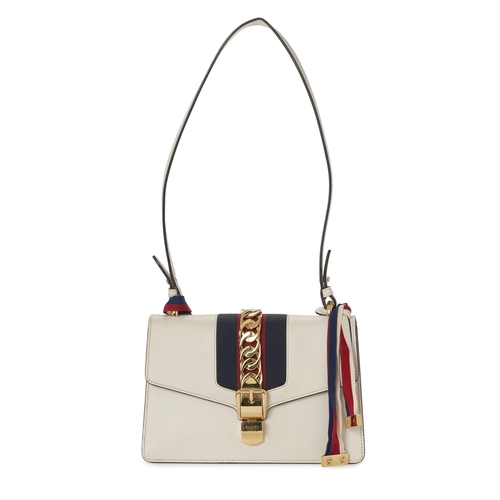 368 - Gucci, a Sylvie Web handbag, designed with a smooth white leather exterior, featuring a blue and red... 