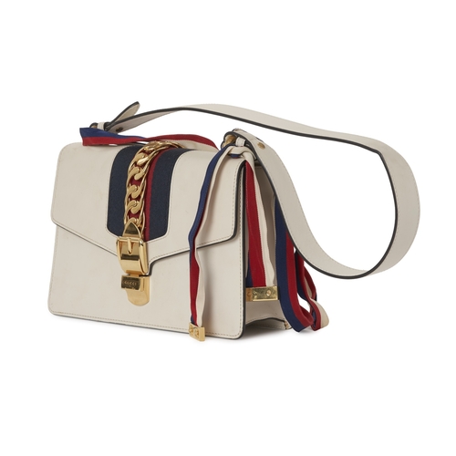368 - Gucci, a Sylvie Web handbag, designed with a smooth white leather exterior, featuring a blue and red... 