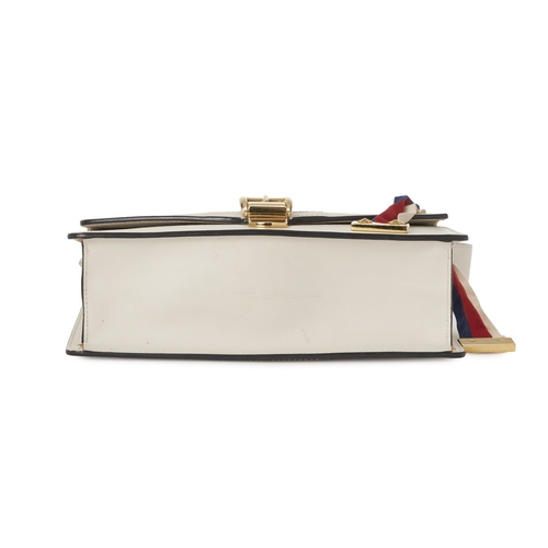368 - Gucci, a Sylvie Web handbag, designed with a smooth white leather exterior, featuring a blue and red... 