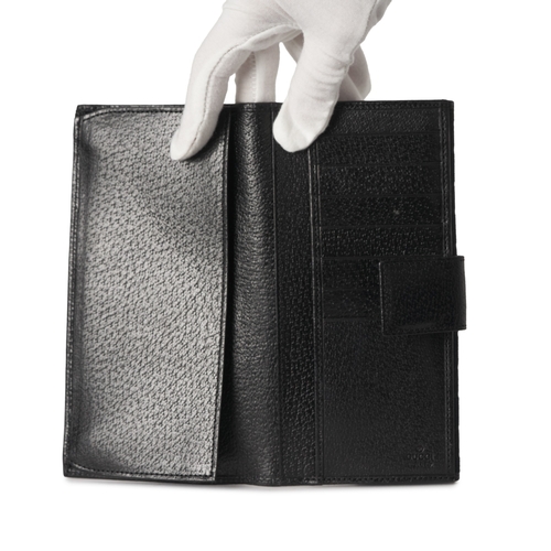 375 - Gucci, a black GG continental wallet, crafted from black GG canvas, with black leather trim, silver-... 