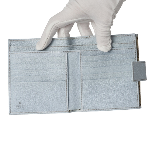 377 - Gucci, a Swing compact wallet, crafted from GG canvas, with light blue leather trim, double-sided wi... 