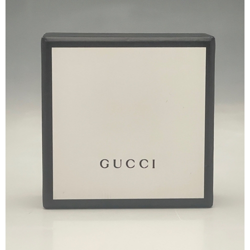 381 - Gucci, a silver pendant necklace, signed Gucci, stamped Made In Italy, AG 925, length of pendant 2cm... 