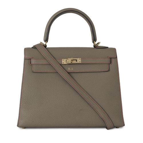 384 - Hermes, a HSS special order 2020 Kelly Sellier 25 handbag, crafted from grey leather with contrastin... 