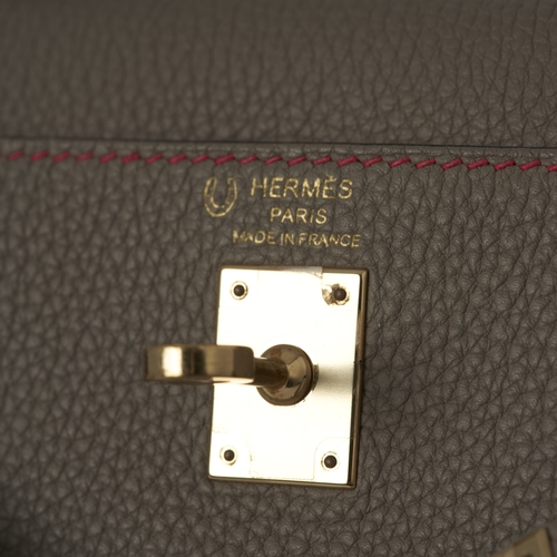 384 - Hermes, a HSS special order 2020 Kelly Sellier 25 handbag, crafted from grey leather with contrastin... 