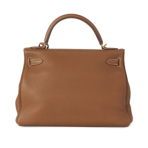 385 - Hermes, a 2014 Kelly Retourne 32 handbag, crafted from tan leather, with gold-plated hardware, featu... 