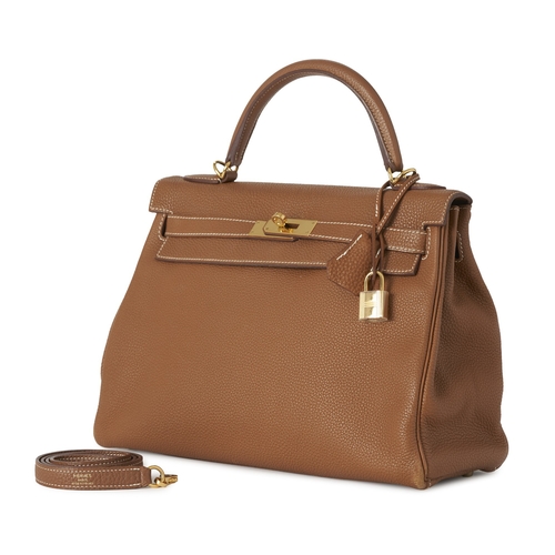 385 - Hermes, a 2014 Kelly Retourne 32 handbag, crafted from tan leather, with gold-plated hardware, featu... 
