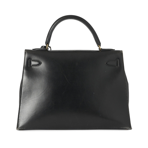 386 - Hermes, a vintage Kelly Sellier 32 handbag, crafted from black box calf leather, with gold-plated ha... 