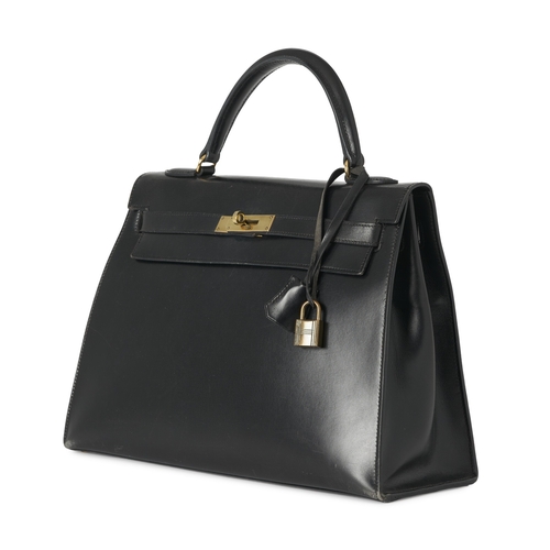 386 - Hermes, a vintage Kelly Sellier 32 handbag, crafted from black box calf leather, with gold-plated ha... 