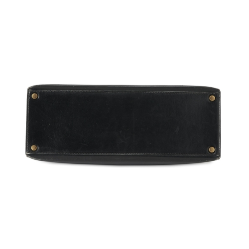 386 - Hermes, a vintage Kelly Sellier 32 handbag, crafted from black box calf leather, with gold-plated ha... 