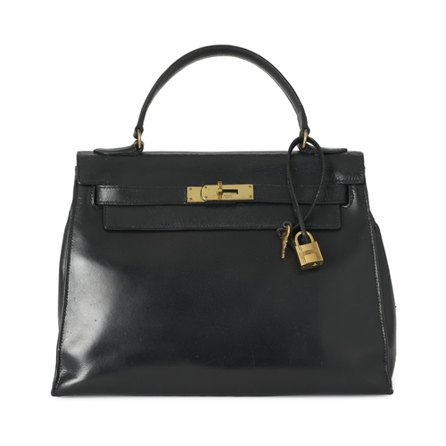 387 - Hermes, a vintage 1956 Kelly Seller 28 handbag, crafted from box calf leather, with gold-plated hard... 