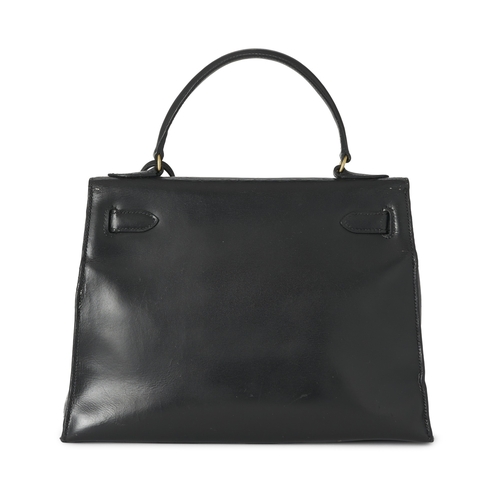 387 - Hermes, a vintage 1956 Kelly Seller 28 handbag, crafted from box calf leather, with gold-plated hard... 