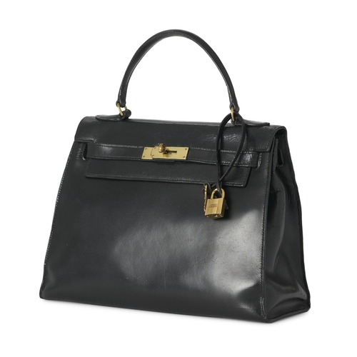 387 - Hermes, a vintage 1956 Kelly Seller 28 handbag, crafted from box calf leather, with gold-plated hard... 