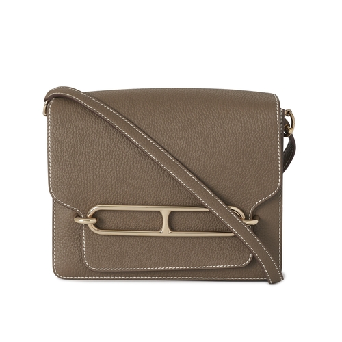 390 - Hermes, a 2022 Roulis 23 handbag, crafted from Etoupe taupe leather, with Palladium-plated hardware,... 