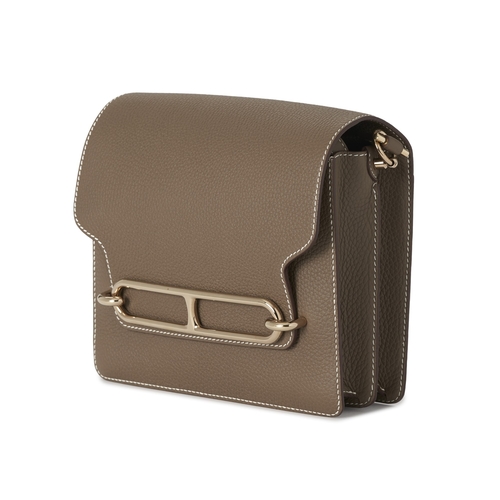 390 - Hermes, a 2022 Roulis 23 handbag, crafted from Etoupe taupe leather, with Palladium-plated hardware,... 
