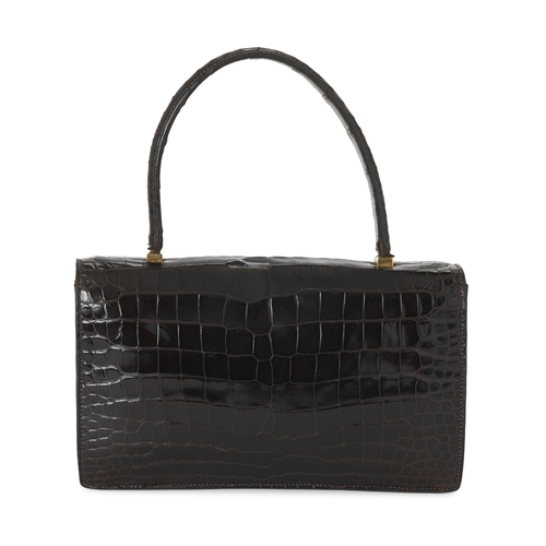 393 - Hermes, a vintage brown crocodile Piano handbag, featuring gold-plated hardware accents, with a sing... 