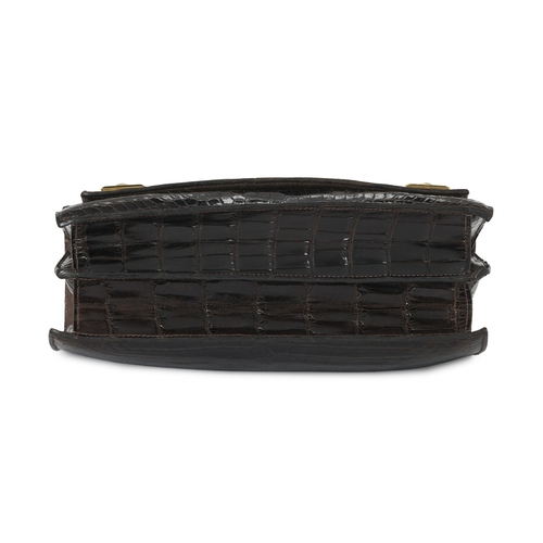 393 - Hermes, a vintage brown crocodile Piano handbag, featuring gold-plated hardware accents, with a sing... 