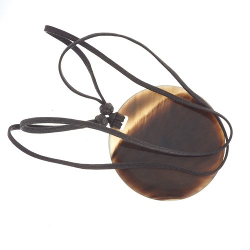 410 - Hermes, a buffalo horn pendant, with an adjustable cord, signed Hermes Paris, stamped Made In Vietna... 