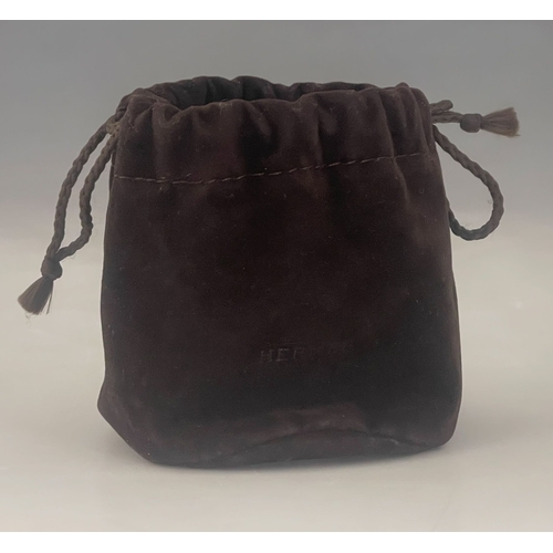 410 - Hermes, a buffalo horn pendant, with an adjustable cord, signed Hermes Paris, stamped Made In Vietna... 